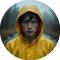 Circular portrait avatar of Jonas Kahnwald wearing a yellow raincoat